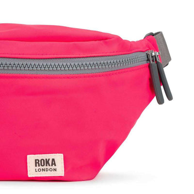 ROKA London Jubilee Sling Recycled Nylon Bag - Raspberry Neon | Yarn Worx